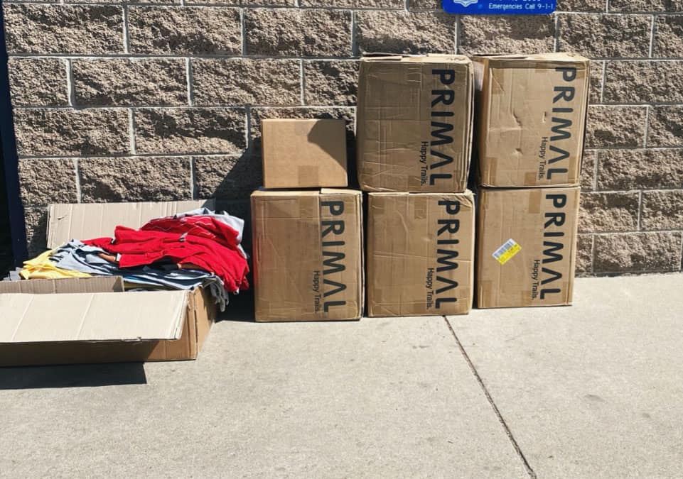 Primal Wear gives t-shirts and socks to Samaritan House Denver